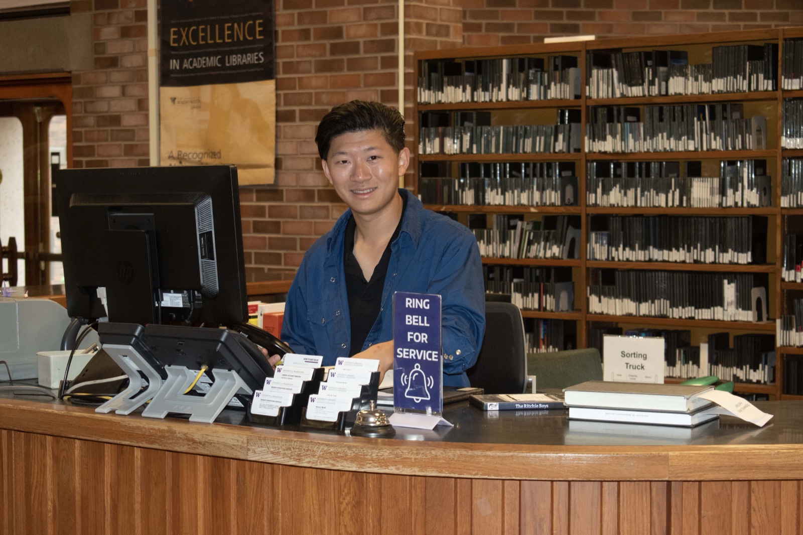 Francis sitting at a desk in the Engineering Library